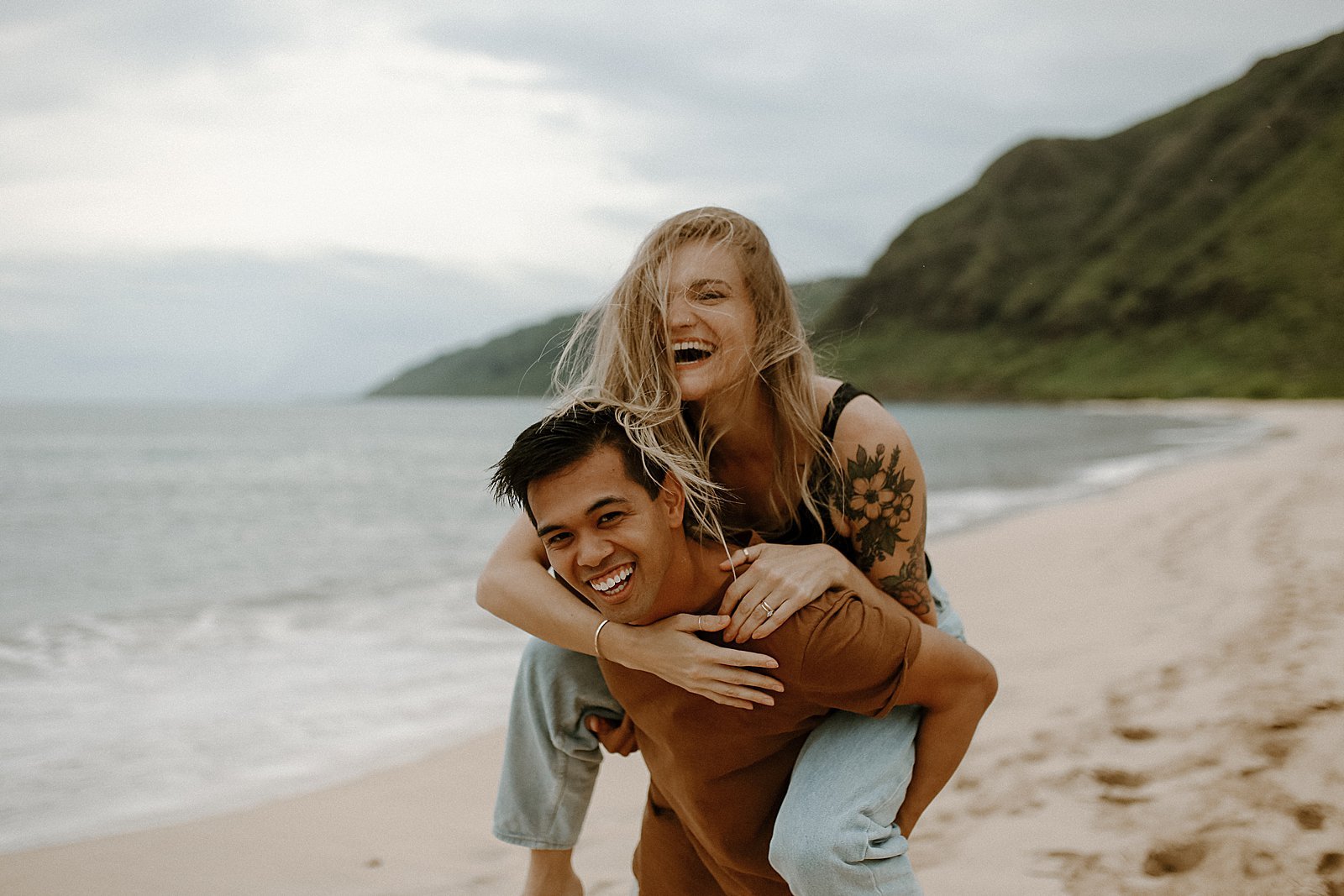 hayley and christian's adventurous couple session at makua beach in oahu, hawaii by briana willis photography