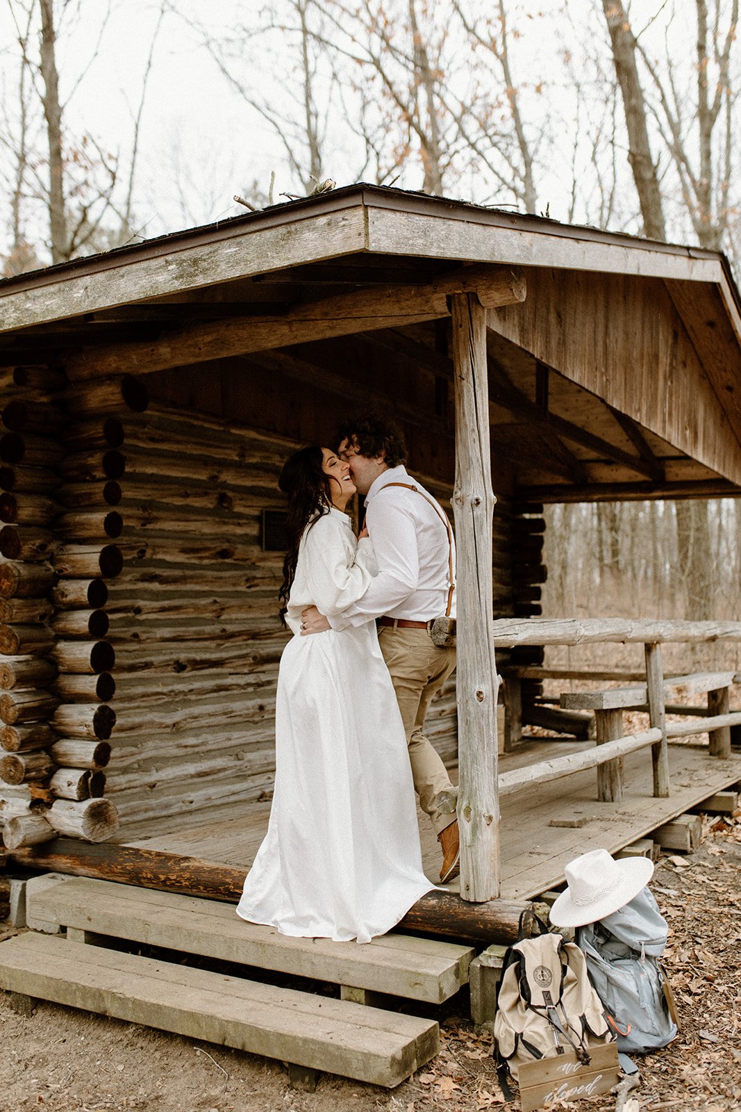 Getting ready at a cabin in the woods on North Country Trail for their elopement